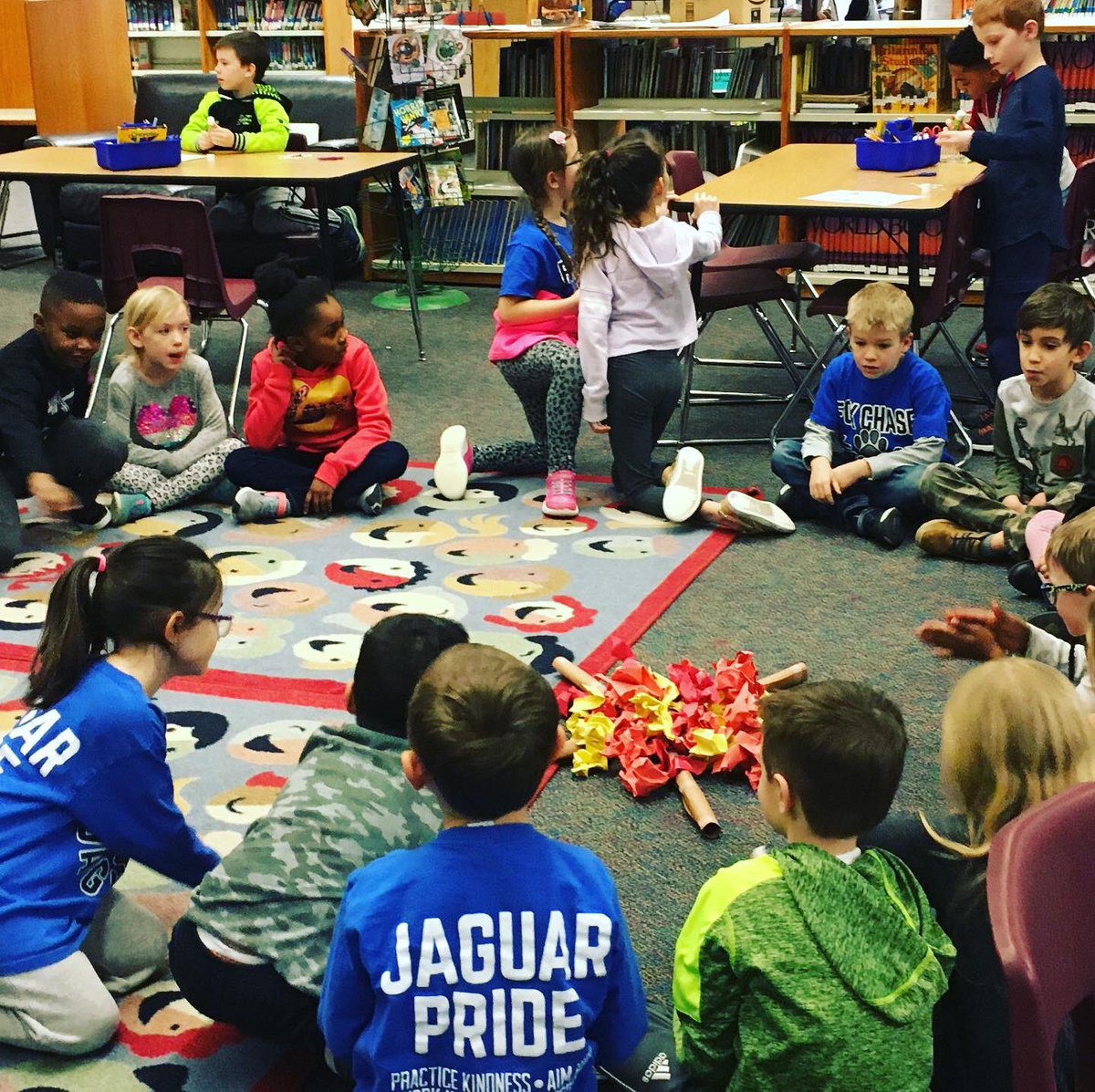 FoxLrc's tweet photo. @foxlrc 1st grade students listened to a “read aloud” from Raven by Mrs. James while sitting around their “campfire.” @RLong308 #library #fcspecials #readaloud https://t.co/FxGloOI6xN