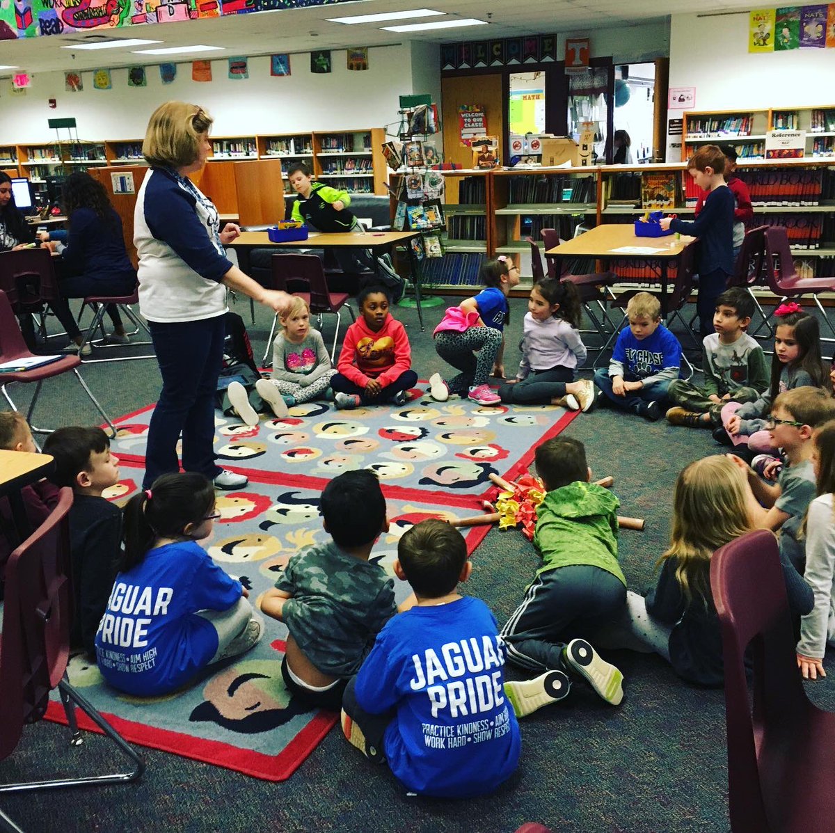 FoxLrc's tweet photo. @foxlrc 1st grade students listened to a “read aloud” from Raven by Mrs. James while sitting around their “campfire.” @RLong308 #library #fcspecials #readaloud https://t.co/FxGloOI6xN