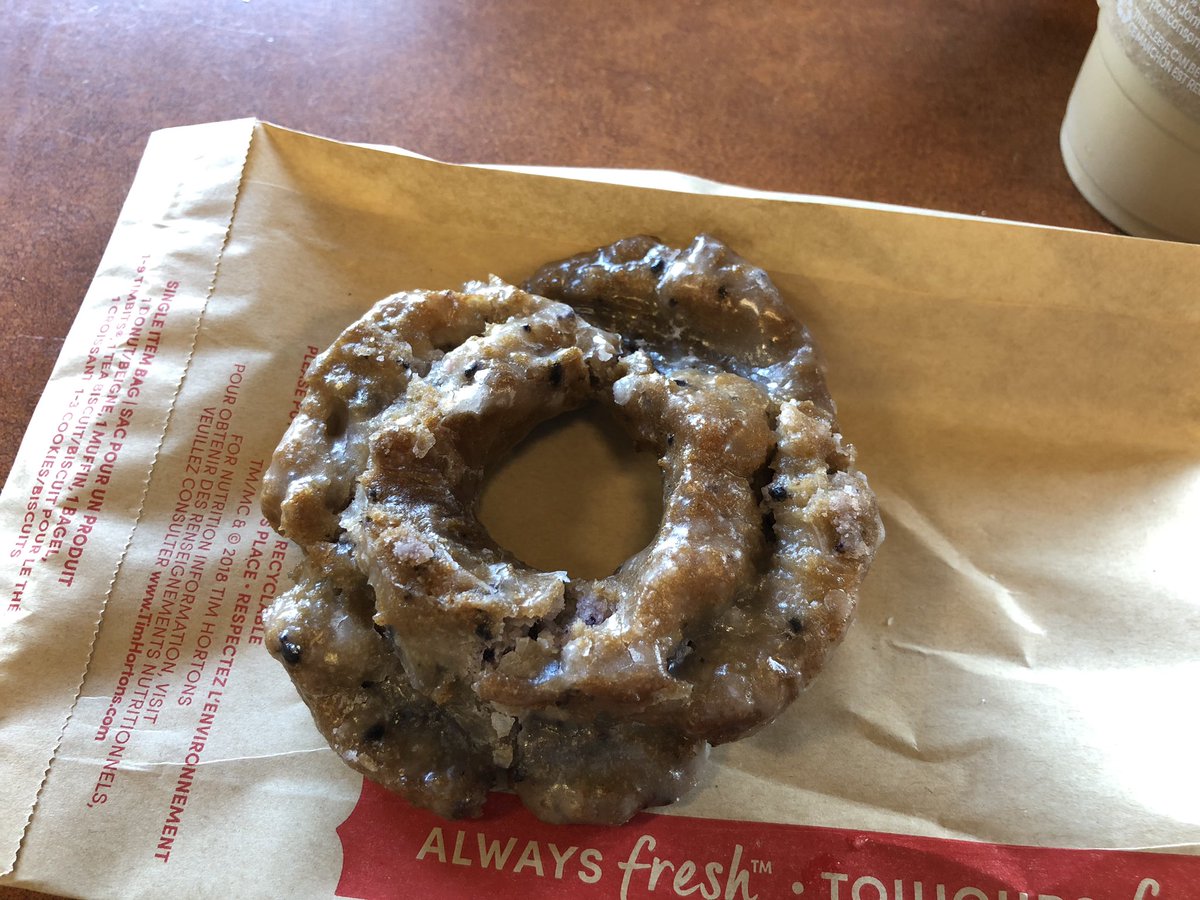 JackComben's tweet image. Looking at my @TimHortons blueberry donut I’m expecting the other ‘half’ to be delivered to the table. Photo doesn’t do it justice but it looked half a thick with parts missing. #ExpectedMore ☹️