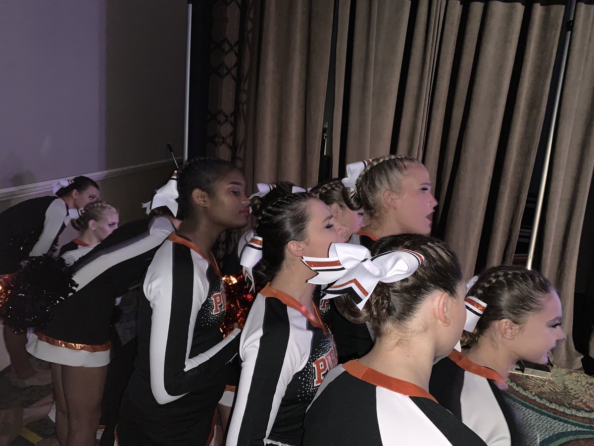Our PC girls cheering on another black and orange team right before them! 🧡🖤