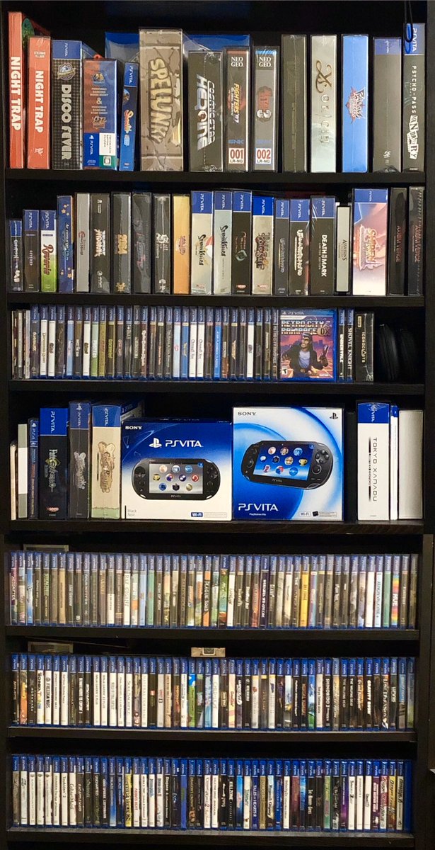 nickportman's tweet image. PS Vita NA release 8th anniversary seems appropriate for an updated shelf photo. Playing the Switch Lite more often these days but the Vita will still be my favourite for a long time to come.  #VitaIsland  #TeamHandheld @eastasiasoft @DrinkBoxStudios @RetroCR @LimitedRunGames