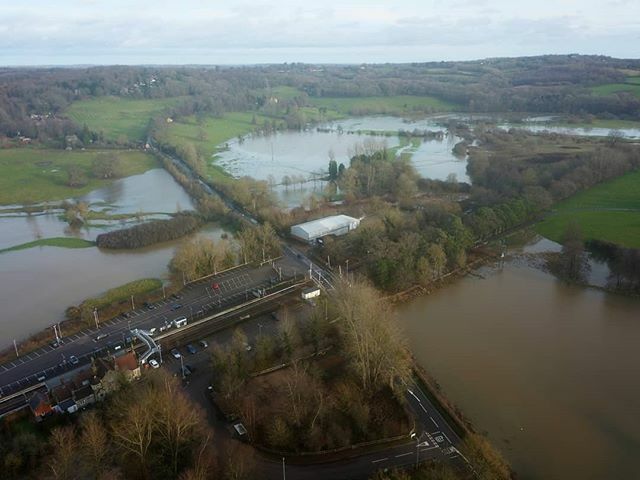 VolantiImaging's tweet photo. Etchingham Station, East Sussex. 
Flooded fields around the station, not quite as bad as earlier this year where the water was covering cars in the  station car park. 
Shot between downpours and gusts of up to 40mph.

#stormdenis #storm #flood #flooded #… https://t.co/R3RwvGpiSg https://t.co/kT9mYCg4ZX
