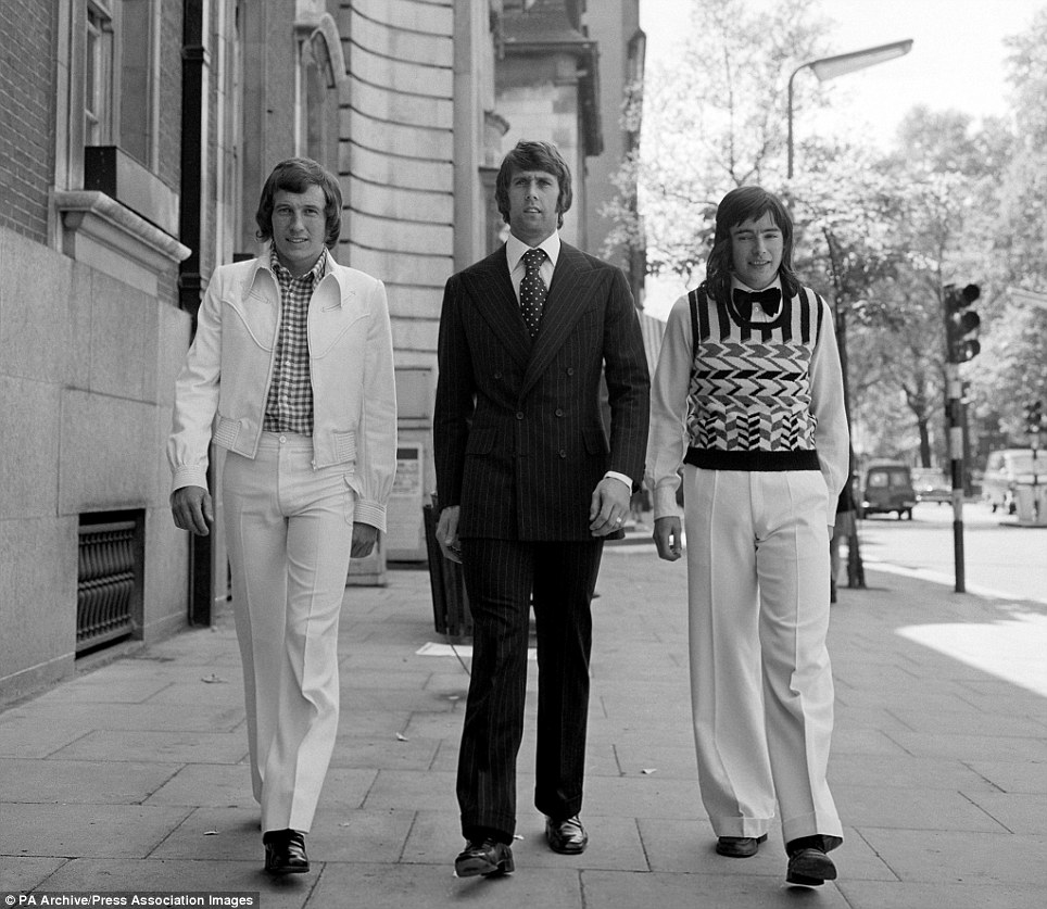 Arsenal's Bob McNab, West Ham's Geoff Hurst and Arsenal youngster Peter Marinello are pictured before a special charity modelling shoot of Playboy international menswear in London in 1972. No image credit.
