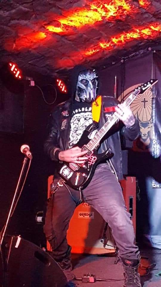 Here he is! The lord of the riffs, as intimidating as he is good, he darkens every room he plays in...
He is RAYNE! \m/ 

(Very nice chap he is too)