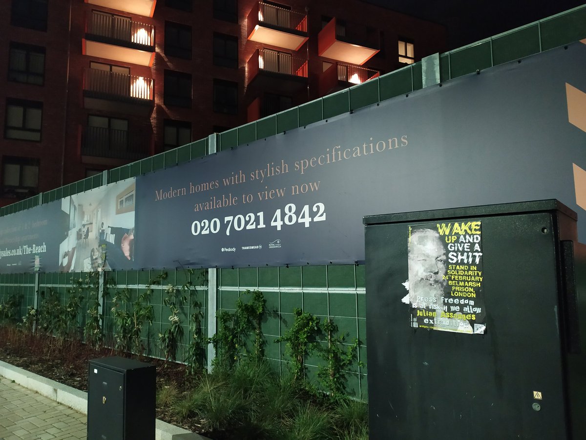 MElmaazi's tweet photo. Posters, stickers, and banners can be found throughout the area, calling on people to "Wake up and give a shit", "wake the fuck up" and "free #JulianAssange". https://t.co/jAhYHGbo1a
