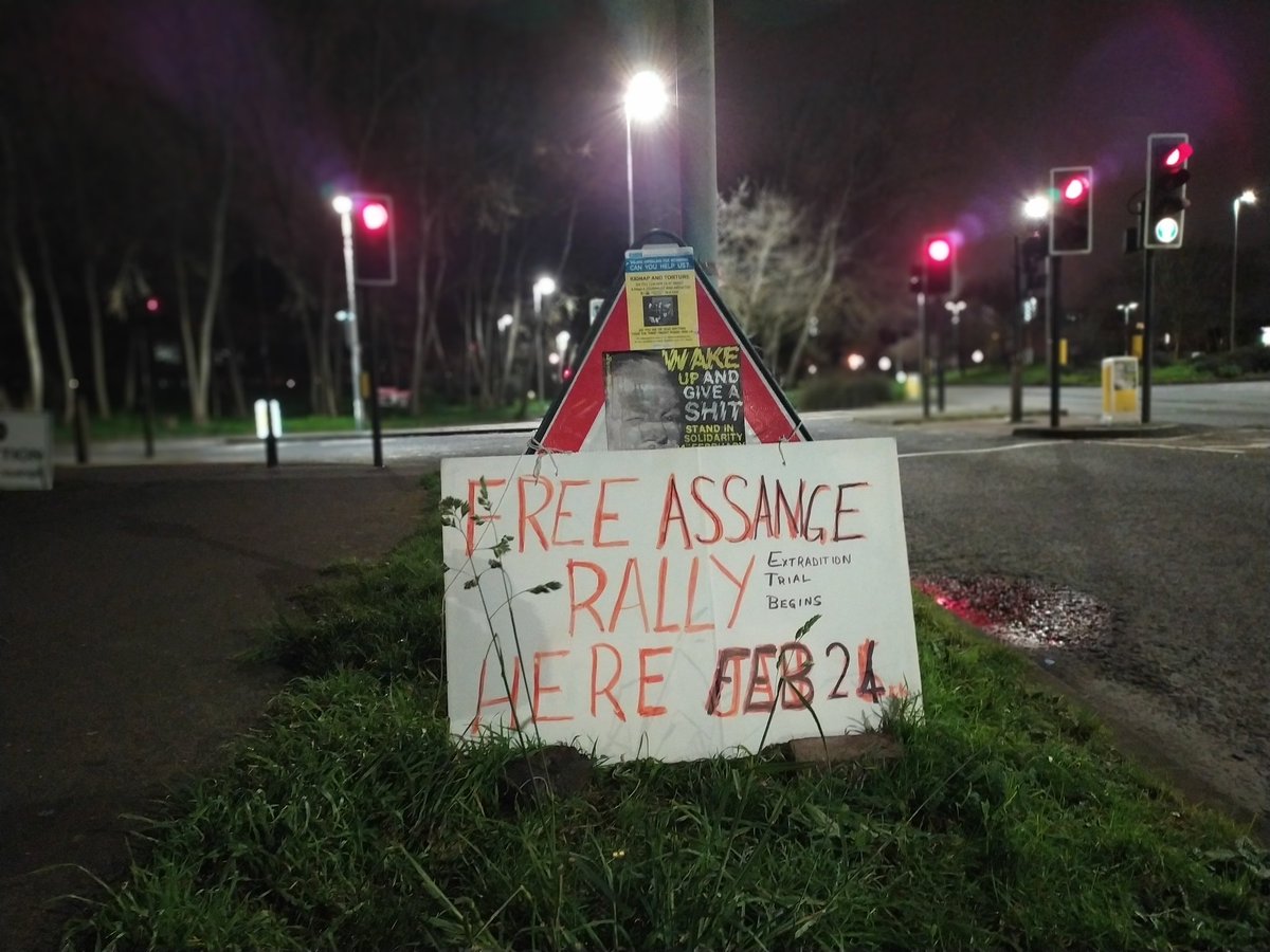 MElmaazi's tweet photo. Posters, stickers, and banners can be found throughout the area, calling on people to "Wake up and give a shit", "wake the fuck up" and "free #JulianAssange". https://t.co/jAhYHGbo1a