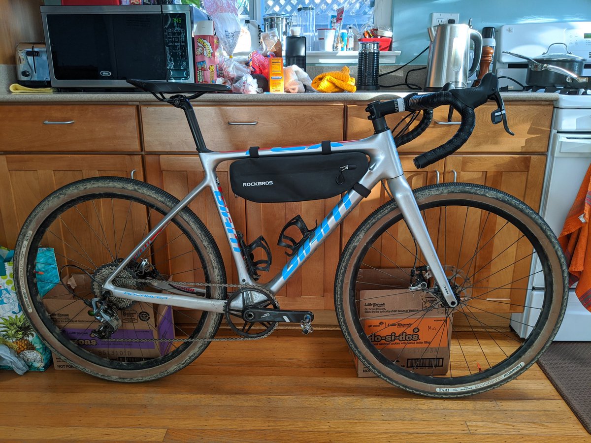 Quan's tweet image. My wife loves it when I have bikes inside the house. Going back to the Arione for DK setup. Extra 65 grams are well worth it. Just need some new wheels. #GarbageGravel #Snackpacking #Couch2Kansas