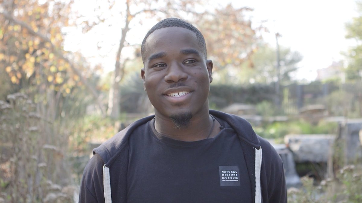 NHMLA's tweet photo. As we continue celebrate #BlackHistoryMonth and recognize the vibrant community of Angelenos at the #NHMLAC, we'd like you to meet Jhaquan Jones, Assistant in General Services, who shares his inspiration of community and discovery found at #NHMLA: https://t.co/FoUW77NOwm https://t.co/EJx27tlrEl
