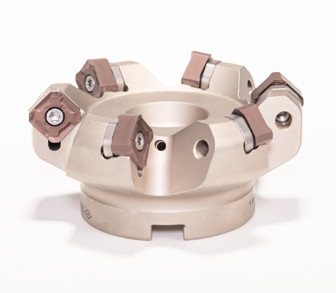 Our DGC milling cutter with SNMT and ONMT inserts, which allow up to 16 corners. Stronger and more economical than single-sided cutters. Max depth of cut is 6mm (0.236").

Check out the details: sumicarbide.com/product/dfc/