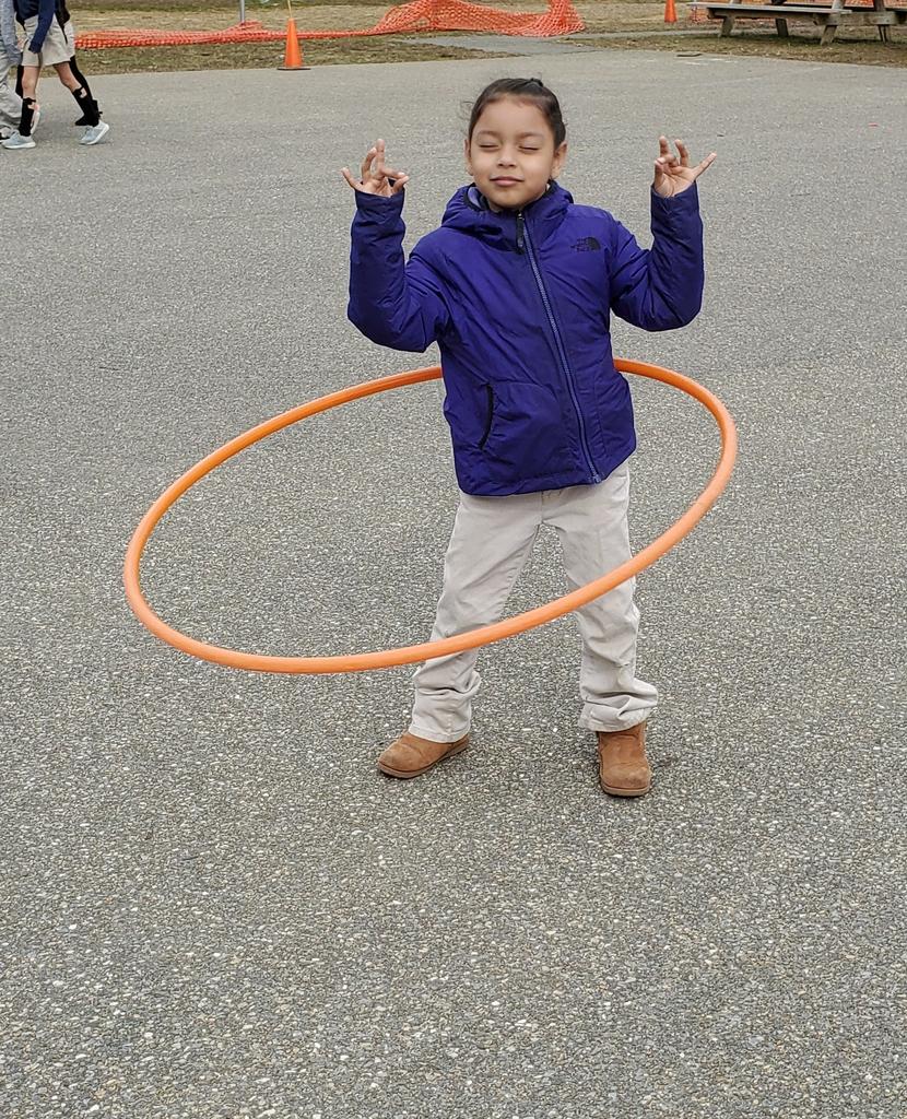 NRoventini's tweet photo. Finding her zen during recess, while hola hooping. She tried to talk this old teacher into trying it, maybe next time (secretly hoping she forgets I said that)! @TylerHeights #1stgrade #teachingisrewarding https://t.co/8ArErZ5dwh