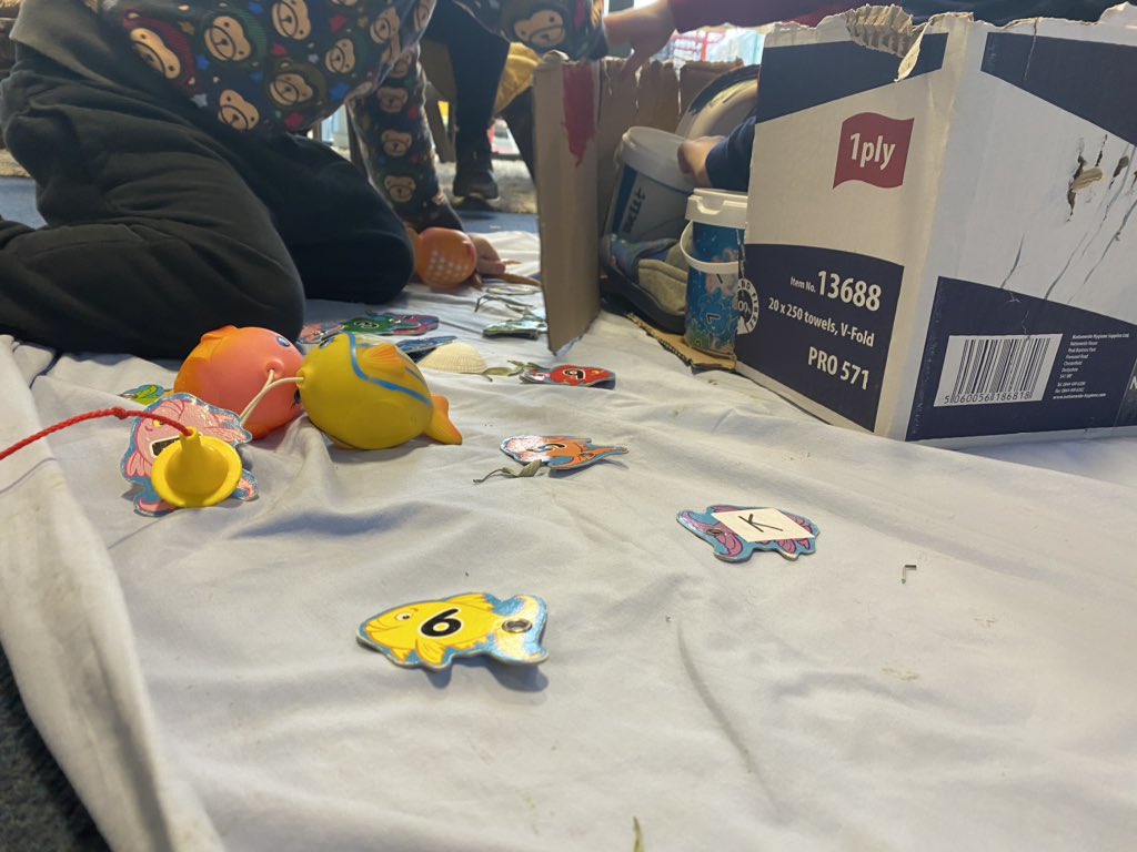 HolmElcc's tweet image. Oh what fun you can have from a cardboard box! It went from a car to a boat... we even went fishing! #SimpleButEffective #EarlyYears #CreativeMinds