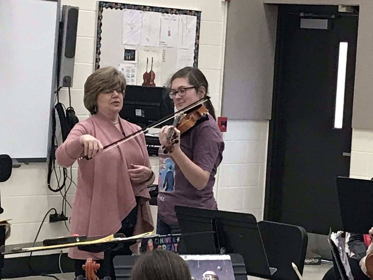 Lisa Rose from Downers Grove schools works with the violins and violas on vibrato. #d45learn4life #orchestraisfun #jcsfund