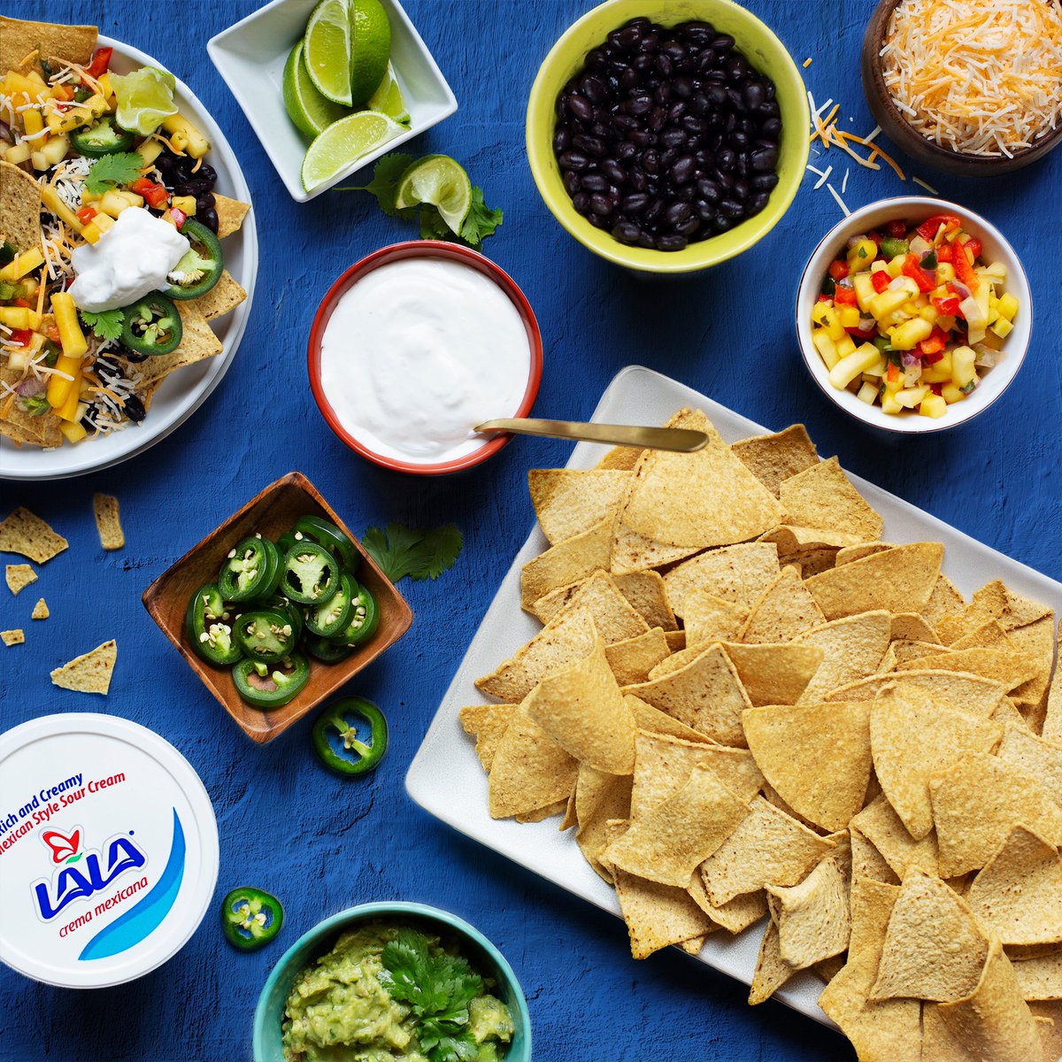 Feliz National Tortilla Chip Day! We’re celebrating with a nacho bar muy padre, how about you? #NationalTortillaChipDay #Nachos #TortillaChips #Crema #SourCream