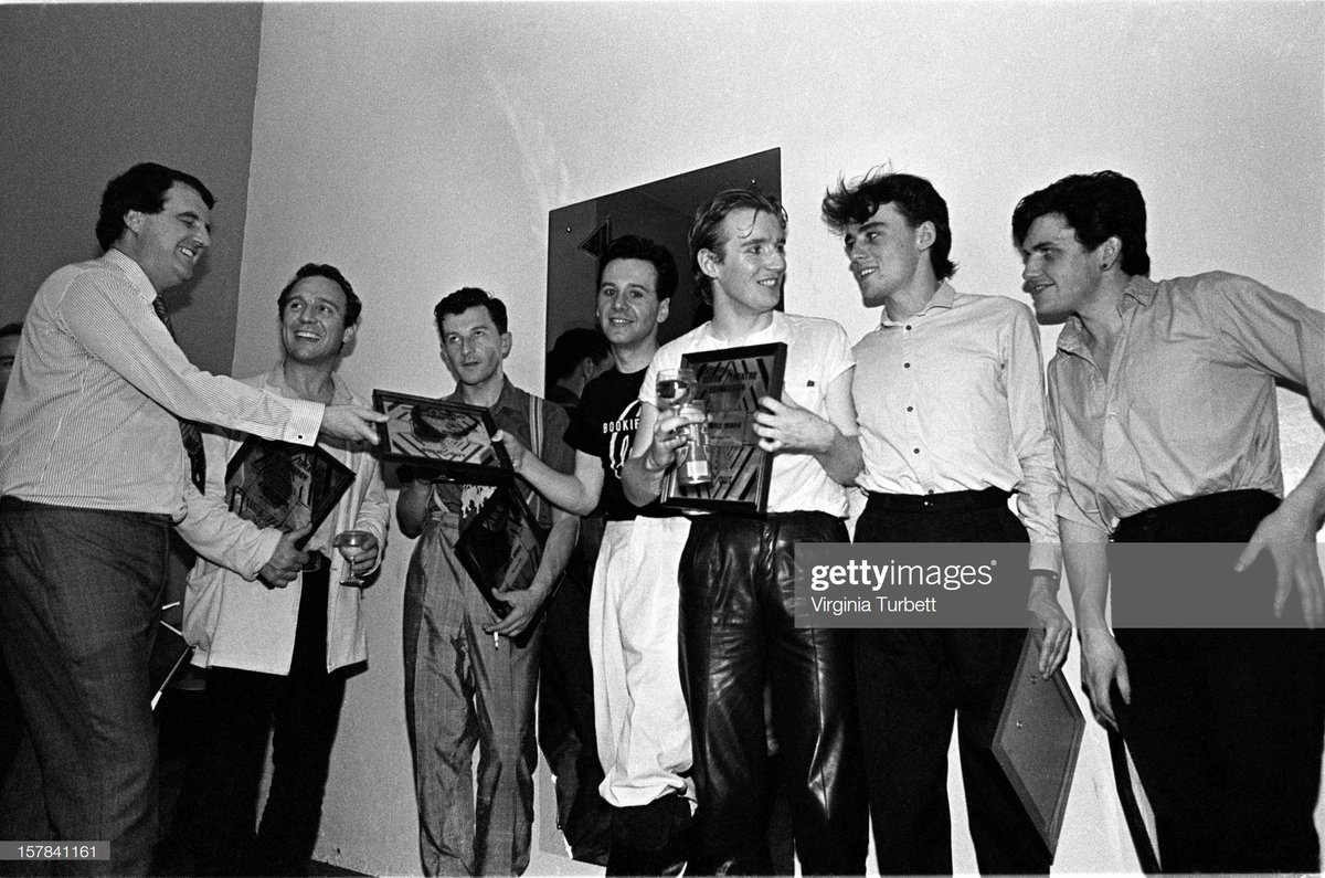 Simple Minds & @brucerisk receive plaques backstage to commemorate selling out 3 nights at Edinburgh Odeon, in August 1981. L-R: Odeon manager(?), Bruce Findlay, Kenny Hyslop, Jim Kerr, Derek Forbes, Mick MacNeil and Charlie Burchill. Photo: Virginia Turbett/Redferns
