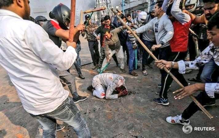 HaiderLareb's tweet photo. Reuters photojournalist Danish Siddiqui took these pictures of a Muslim man being brutally beaten up by pro-CAA 'protestors' in Bhajanpura today, opposite Chand Bagh. He was hit on the head by a sharp object. Armed men in helmets and masks, the police absent -- again. #Chandbagh https://t.co/b8MNXk7bv8