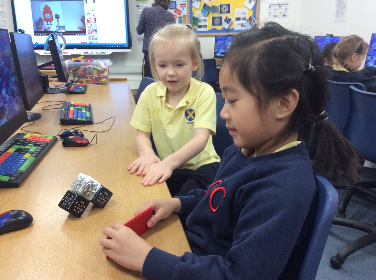 Year 1 enjoying the #STAHSSTEMFest activities by exploring little robots using a brightness sensor to make a lights come on and cubes spin. 🤖 #Robotics #STEM
