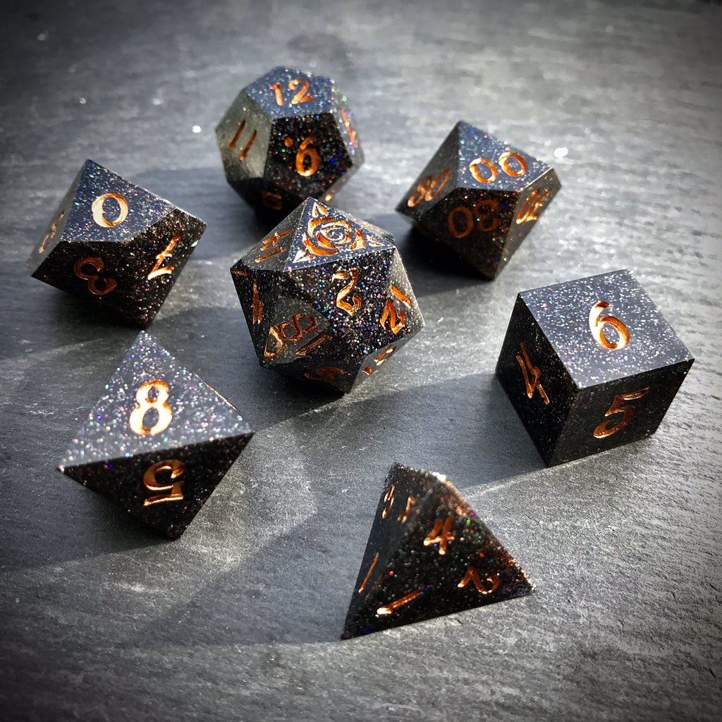ThornlessRoseUK's tweet image. Glittering Black Smoke starts to appear, weaving its way between the wielders fingers. Power building the the spell is released upward, the faerie fire sparks raining down in a beautiful rainbow cascade.

Black holographic glitter #handmadedice set with odd #D20
#ttrpg #dnd #dice