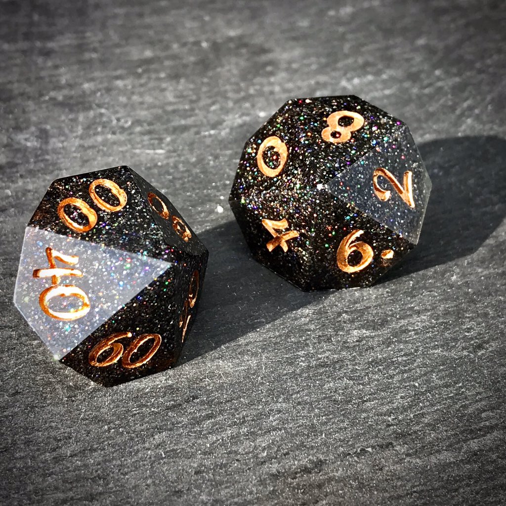 ThornlessRoseUK's tweet image. Glittering Black Smoke starts to appear, weaving its way between the wielders fingers. Power building the the spell is released upward, the faerie fire sparks raining down in a beautiful rainbow cascade.

Black holographic glitter #handmadedice set with odd #D20
#ttrpg #dnd #dice