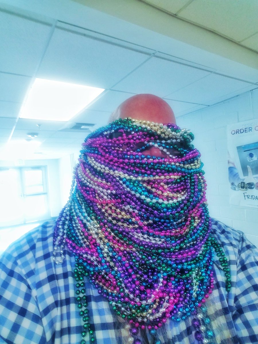 BaldLibrarian's tweet photo. Happy Mardi Gras! I'm throwin' beads today from the library. Come by and get some! #baldlibrarian #rambrary #waltriphighschool #wwblr #whatwouldbaldlibrarianread #waltripreads #hisdlibrariesnow https://t.co/pZv7o70ofe