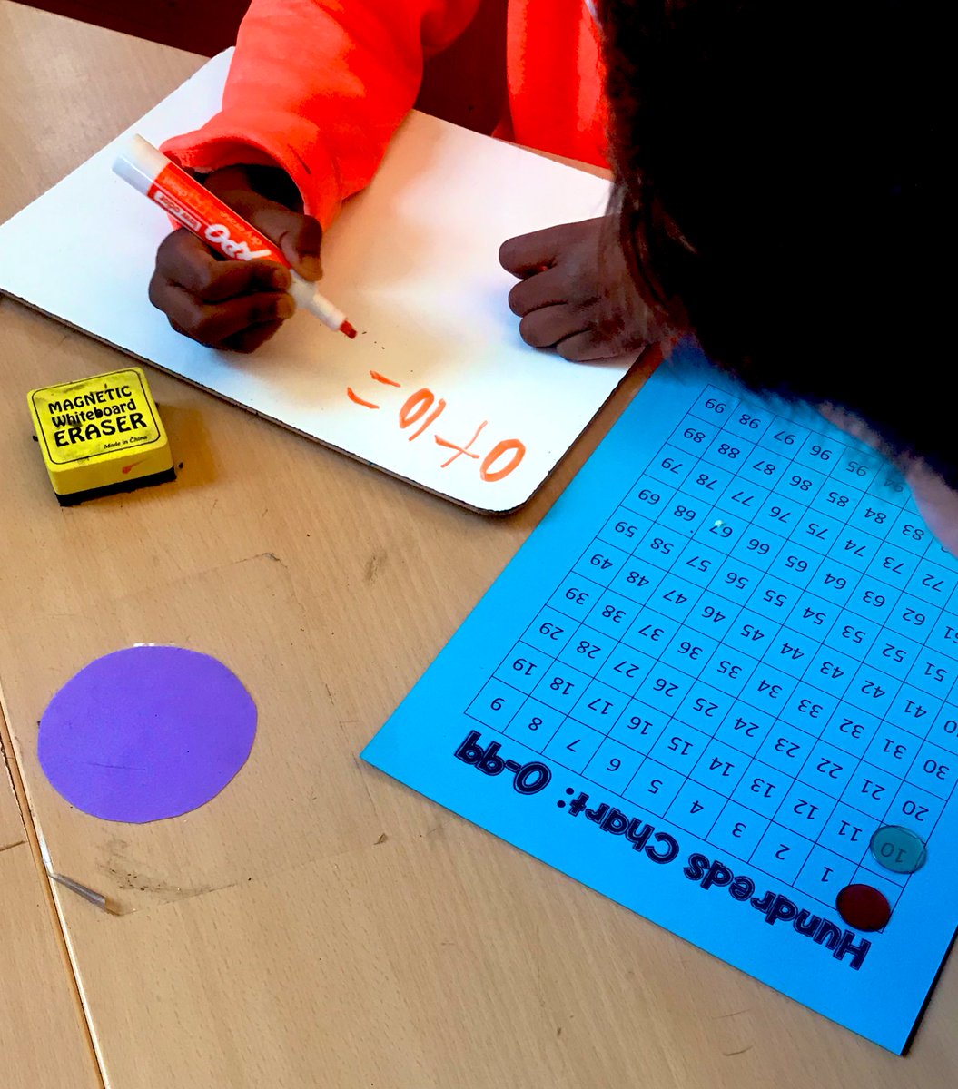 StaceyP1981's tweet photo. Math Centers today... thank @mburnsmath for this game! We have been studying place value in our #firstgrade classroom and this is perfect practice! https://t.co/iGSdQ7z7lH
