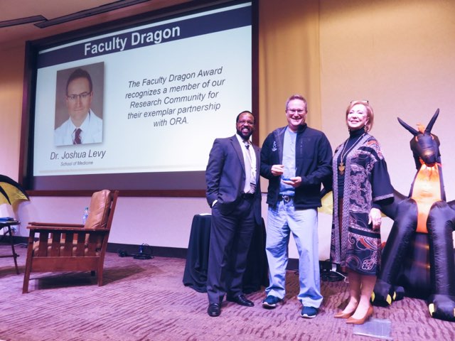 emory_research's tweet photo. Faculty are key to the success of #ORA at #Emory! Today we award @EmoryMedicine Dr. Joshua Levy with the Faculty Dragon Award! This award recognizes a member of our Research Community for their exemplar partnership with ORA. Thank you for your partnership! #EmoryResearch https://t.co/picGuXzceT
