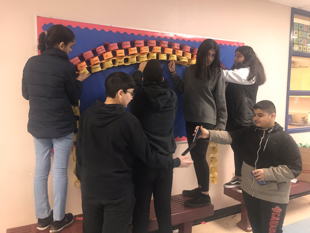 MudgeTeaches's tweet photo. Be a rainbow in someone else’s cloud! 4 lunch periods, tutorial time, &amp; half a block of work went into this Grade 8 created bulletin board for #PinkShirtDay2020! So proud of the kids who volunteered their time to create a positive message for our school! #ltslearns #sd36learn https://t.co/WsTlRMd7uH