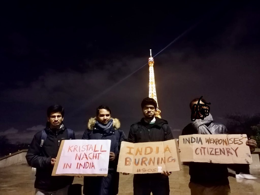 kmadhuresh's tweet photo. A lot of people in Delhi keeping vigil tonight and so are many around the world. @sachinme and friends from @paris_alliance  keeping vigil in front of Effiel tower Paris. All strength to them. Desh bahut pyaara hai, jalane mat do... #Solidarity #DelhiRiots https://t.co/HwBLRxlzvw