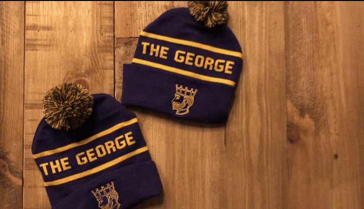 Are you rocking our apparel yet? 💜💛#thegeorgeonmain #customclothing #kinggeorge