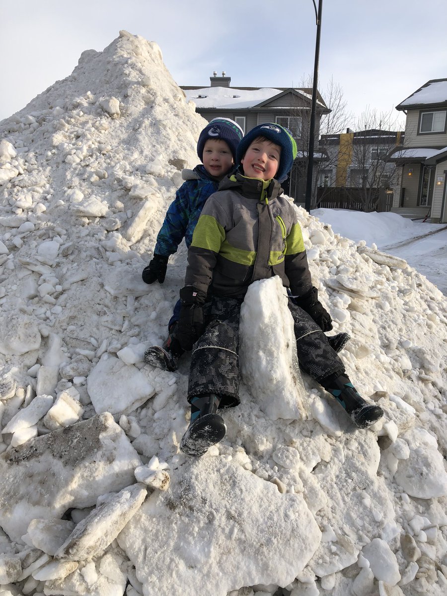 megstweis's tweet photo. Riding the giant snow dinosaur we came home to in our neighborhood today. Some pretty pumped boys! #yeg https://t.co/tDup5nZ5tx