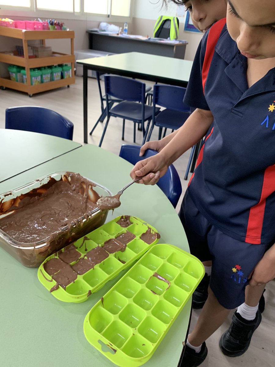 AIS_DigitalEd's tweet photo. Reversible and Irreversible Changes.  In Grade 3 we turn solid chocolate into a liquid by heating it up, poured it into molds and made it solid again by cooling the liquid down. Science is delicious! #AISGrade3 https://t.co/6J0Mz1Ak5e