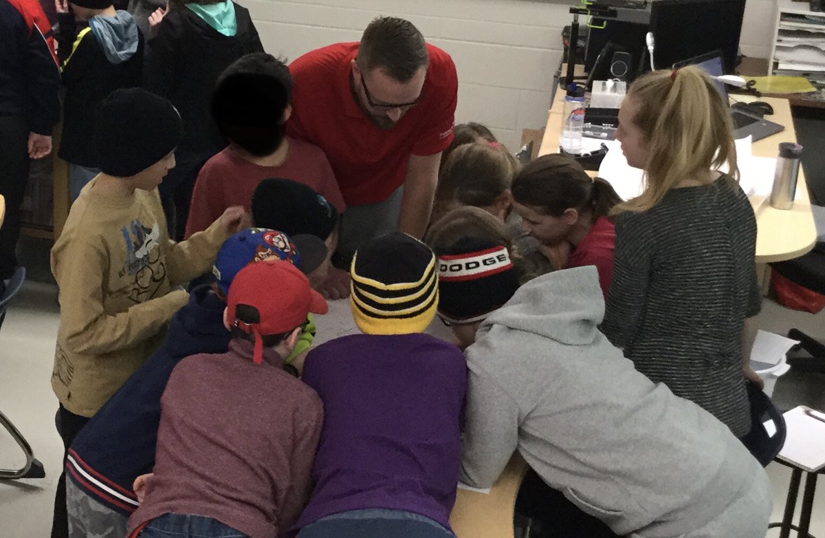 cityofsteinbach's tweet photo. City Engineers visited a Grade 5 class @clearspringhsd this week to explain what Engineering is and what Engineers do. The students did a scaling and measurement exercise which they got to try out on the construction drawings of their own school! #SchoolisCool #SteinbachMB https://t.co/qkki7WuQQl