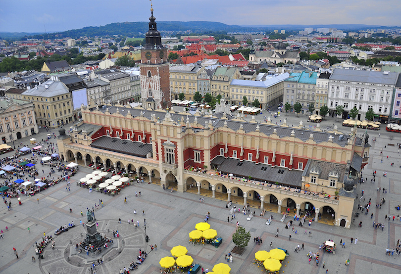 Main market Square in PolandCheck it outArchesBig proboscis tower antennaBuildings form a wall for energy waves to collect in Monument in a circle to walk around and take picsChairs to lounge in and donate electrons