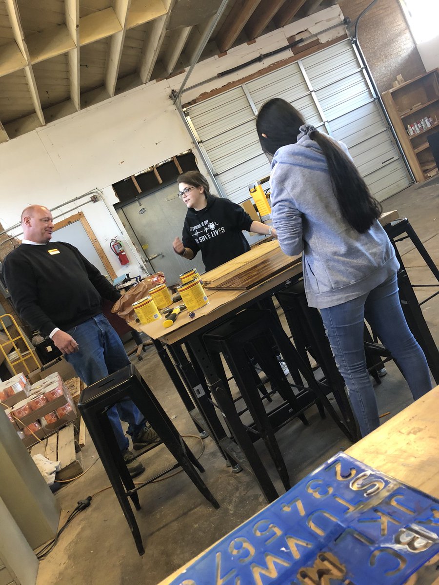 MrsLillie's tweet photo. Busy during Tech II today. Ss staining wood in the shop with Mr. Grammar, in the gym flying drone, and others working on cardboard boats! #cmsok #cpsreds https://t.co/LYrH8Kppos