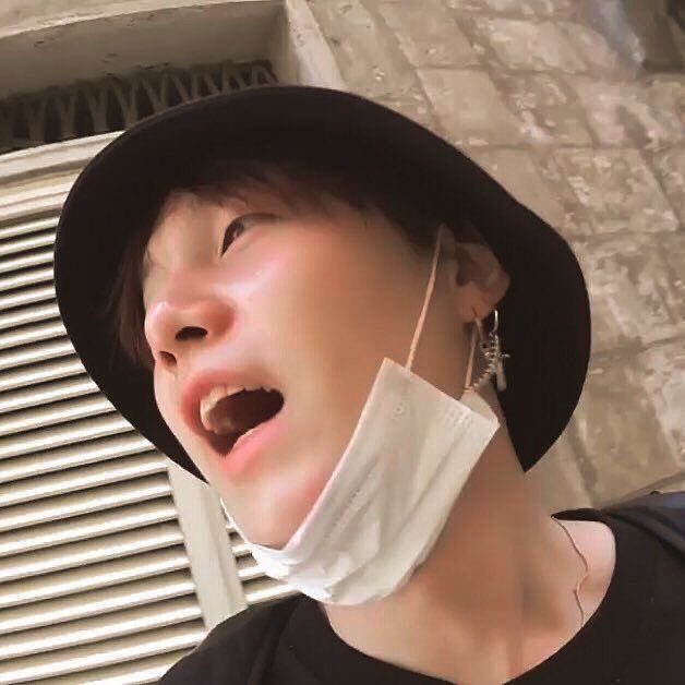 Yoongi with his mask on his chin because it’s so cute I’m 