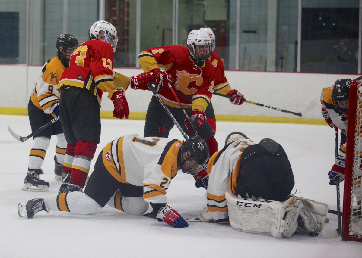 Geoff_Walter's tweet photo. .@cflyershockey takes first game of Finals 4-3 in OT against St. Anthony's - here's goal from Nick Esposito (and his reaction) with puck behind goalie (Friar player trying to scoop out of net) and ensuing dogpile #FlyersHockey https://t.co/ftR5nzM5hy