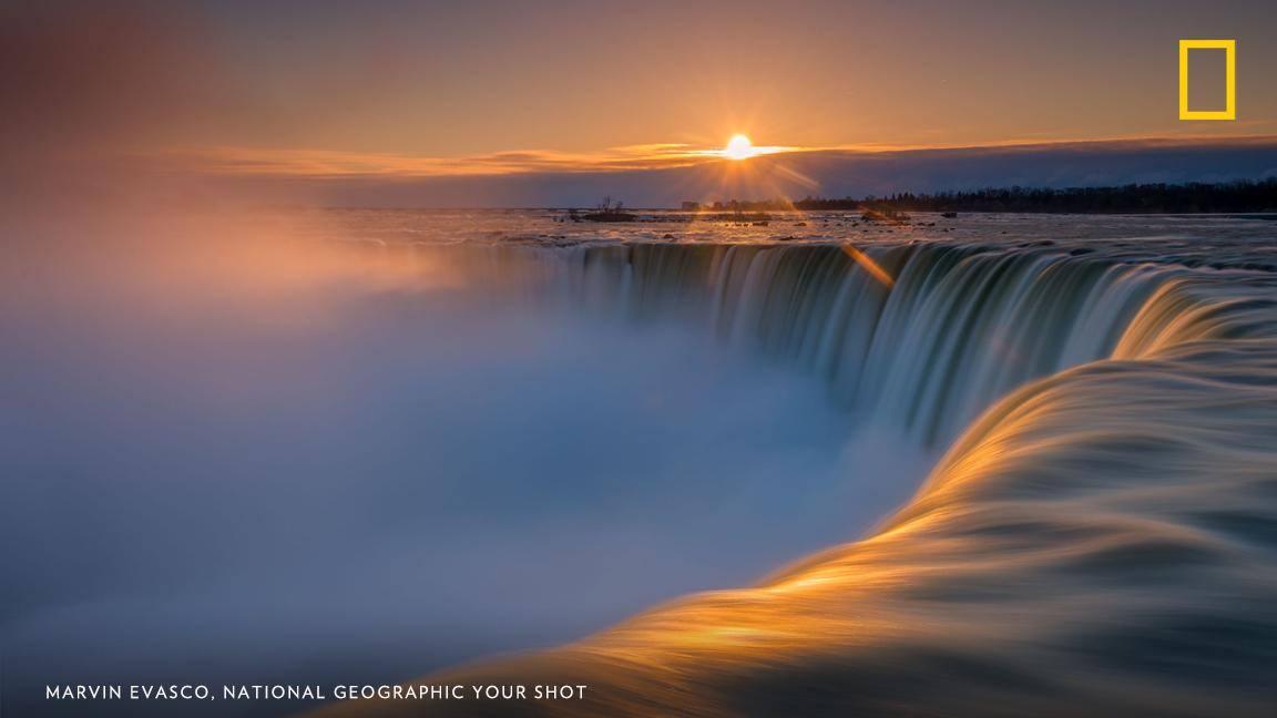 Your Shot photographer Marvin Evasco chose a vantage point near Niagara Falls that offered a closer look at the water, and a gorgeous reflection of the sun.