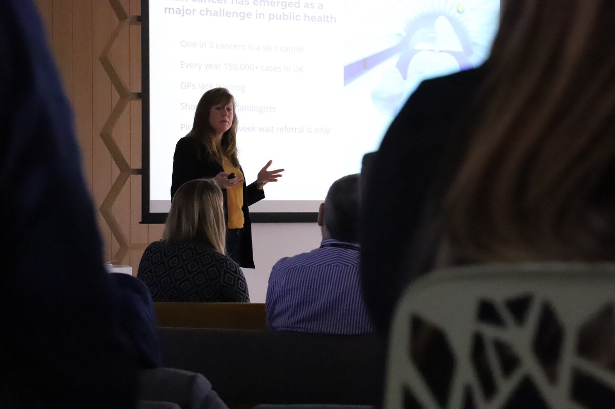 SWSCN's tweet photo. Loes Vanegmond from @SknVsn demonstrating the use of smart phones to assist patients in self checking skin lesions at our AI and Digital Cancer Pathway Innovation Exchange event at the @sw_ahsn in Exeter. #AIinCancer https://t.co/OWgIrkRBgz