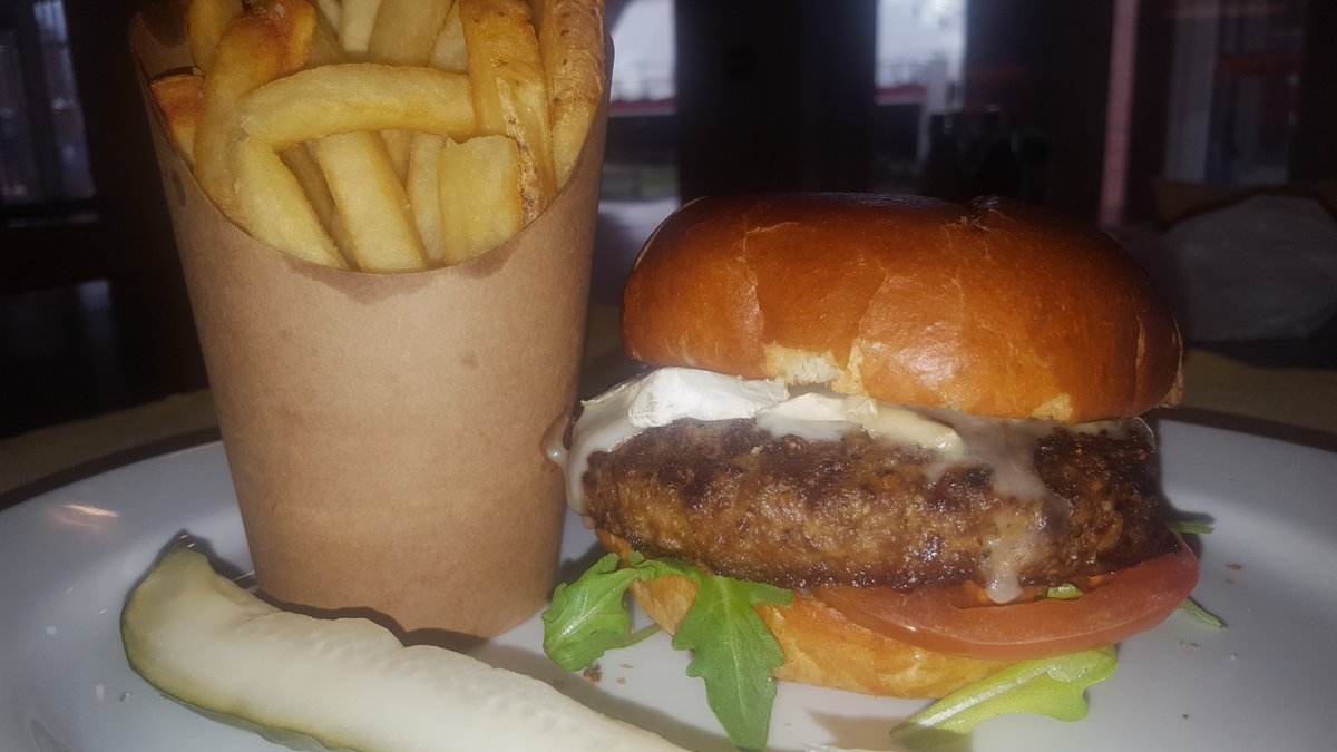 Lemon Herb Chef's Creation Wings and our Arugula, tomato, onion jam and truffle Camembert Kitchen's Whim Burger! Try these delicious specials today only! #ChampionsCambridge #WingsToMakeYouSing #FlavorOfTheDay #Foid #DailySpecials