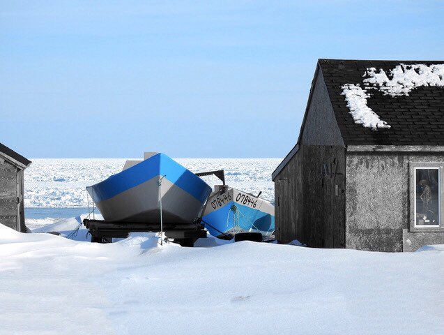 Flat bottom lobster fishing boats on the shore at Sally’s Cove. Many of these lobster boats have provided families with a good living lobster fishing here.