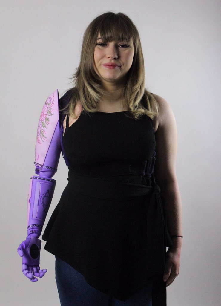 IzzyMcInnes's tweet photo. I love these pictures of Toni rocking her new shoulder disarticulation prosthesis, with 3 sets of switchable covers on the shoulder and forearm, a compartment for cosmetics and a portable phone charger! 🦾💖 Designed in #rhino3D, 3D printed and then dyed and finished by hand. 😊 https://t.co/vp9HQ9lT5w