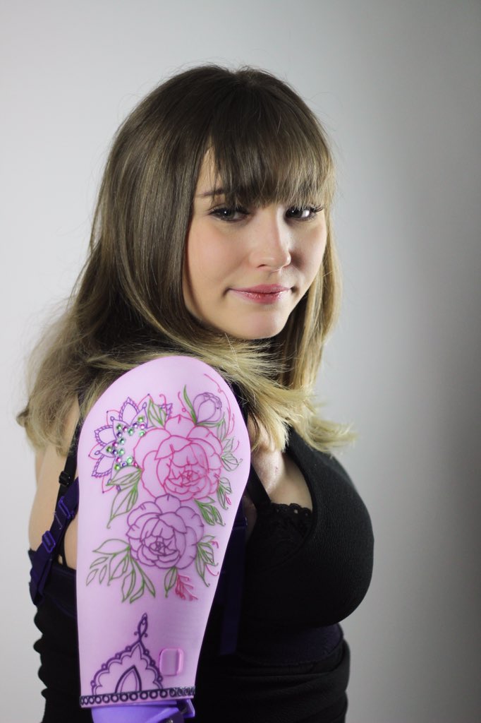 IzzyMcInnes's tweet photo. I love these pictures of Toni rocking her new shoulder disarticulation prosthesis, with 3 sets of switchable covers on the shoulder and forearm, a compartment for cosmetics and a portable phone charger! 🦾💖 Designed in #rhino3D, 3D printed and then dyed and finished by hand. 😊 https://t.co/vp9HQ9lT5w