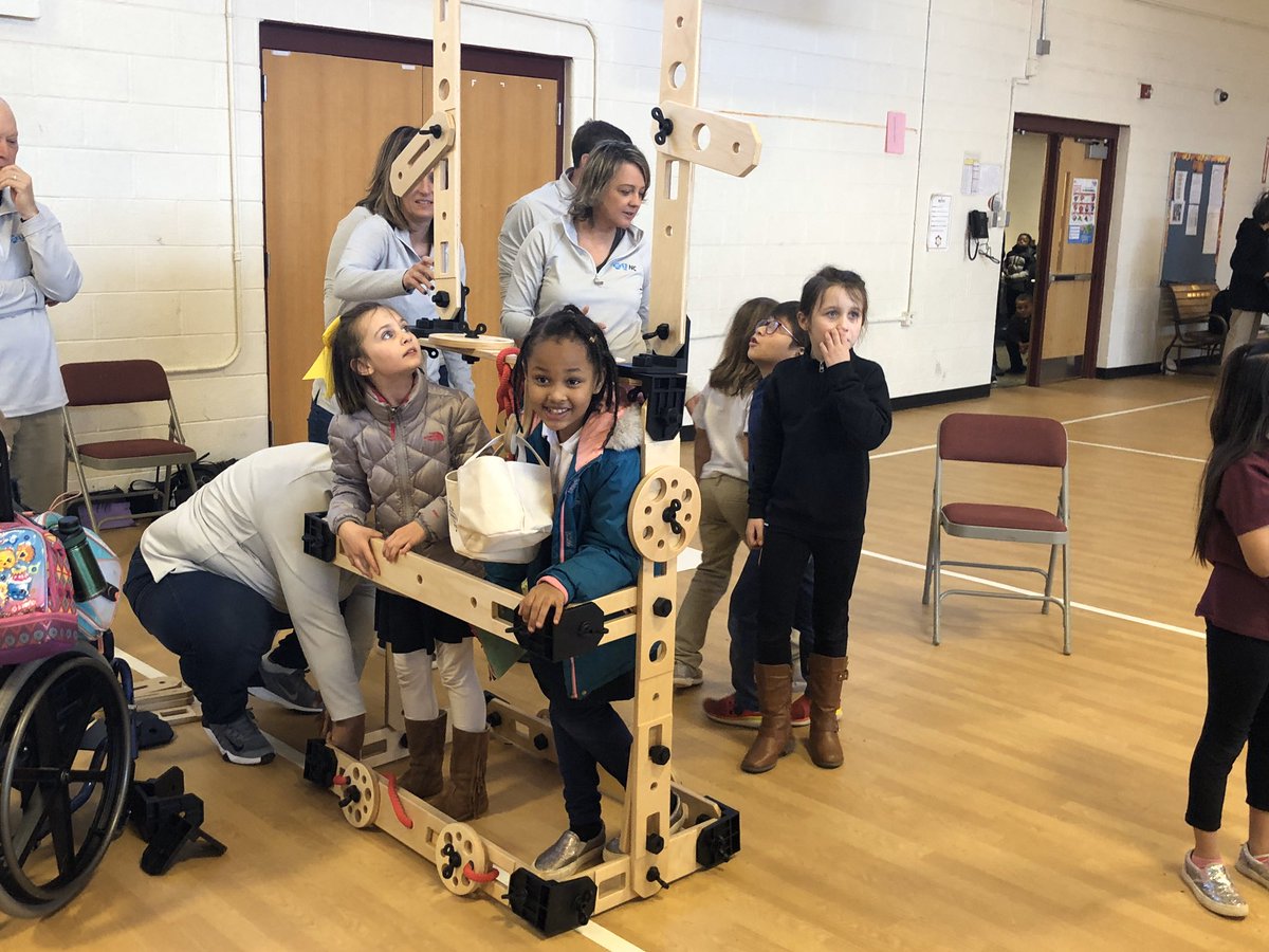 SpeasGlobal's tweet photo. Some of our #SpeasG1 friends are excited to build with our new @Rigamajig equipment. We are so happy to have new friends from @BlueCrossNC here to reveal the plans for our new Kindergarten - 2nd grade #PlayGround funded through a @kaboom grant. @wsfcs @wsfcshealthpe https://t.co/wYG3Xc8r3H