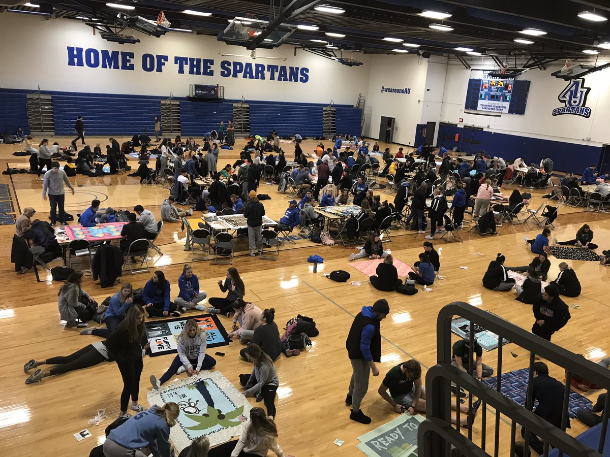 AU_Spartans's tweet photo. Members of the AU athletic programs and the John C. Dunham STEM partnership school made 107 blankets during the 18th annual project Linus event. The blankets will be donated to the Waterford Cancer Center #weareoneAU https://t.co/Rx5tCWRvft