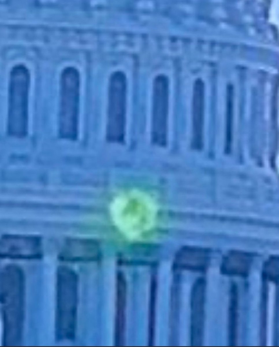 6) Today, the WH is bathed in green light & the Capitol Building has something green projected onto it. It's even caught on video and played on FOX News. (Can that be photoshopped??) Some Anons believe it looks like the White Rabbit Q, as pictured on the hat below. Do you?