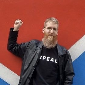 Communicraft's tweet image. Remembering our dear friend and colleague on the anniversary of his death one year ago. We miss you Jon. Our thoughts are with him and all who are missing him today and every day. Jon Hanna, 1976-2019.