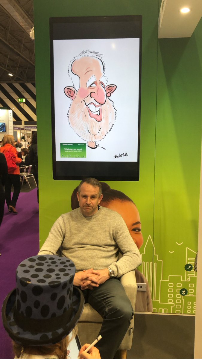 Enabletherapy's tweet photo. Phil, our Accounts and Relationship Manager is having a caricature at the LloydsPharmacy stand at the Health and Wellbeing at Work Conference

We think he looks brill!

@HWatWork @LloydsPharmacy 

#healthandwellbeingatwork #HWatWork2020 #health #wellbeing https://t.co/gCbhi2ThGY