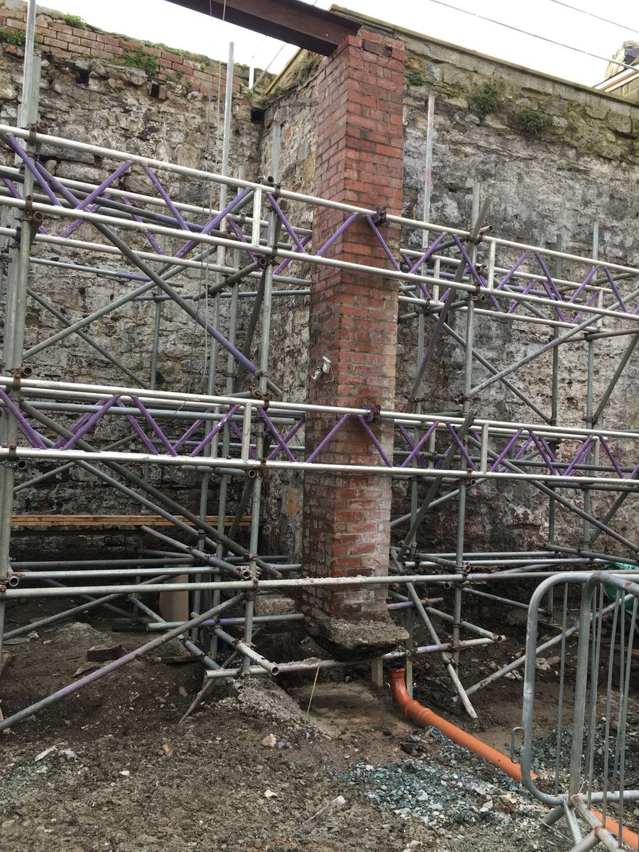 InsallArch's tweet photo. Spotted by our Conwy team on our project at Porth yr Aur, Caernarfon: a fascinating discovery of what appears to be the 700-year-old stone steps leading onto Caernarfon’s town walls and a levitating brick pier ready for underpinning to commence @AnturWaunfawr @mph_northwales https://t.co/UslUluJwmk