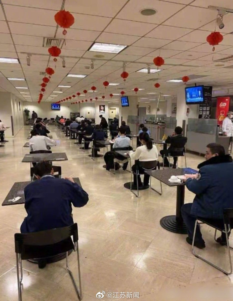 As workers in China return to offices, many systems are being put into place, such as at restaurants and cafeterias, to maintain social distancing. These include rules to eat fast, one-person-to-a-table, cardboard dividers, and admonitions not to talk to each other. 24/