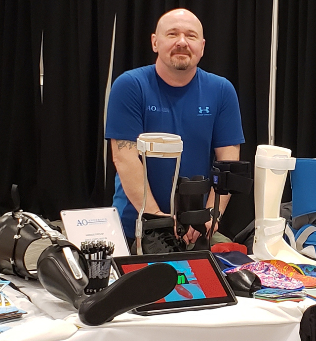AndersonOrthoMB's tweet photo. Anderson Orthopedics Technician Dennis Meaden proudly displays a few of the custom orthotics &amp; prosthetics that have been custom made for patients at @AndersonOrthoMB 

#limbloss #orthotics #prosthetics #tradeshow #afo #kafo #limbitless https://t.co/1yS2EQEDll