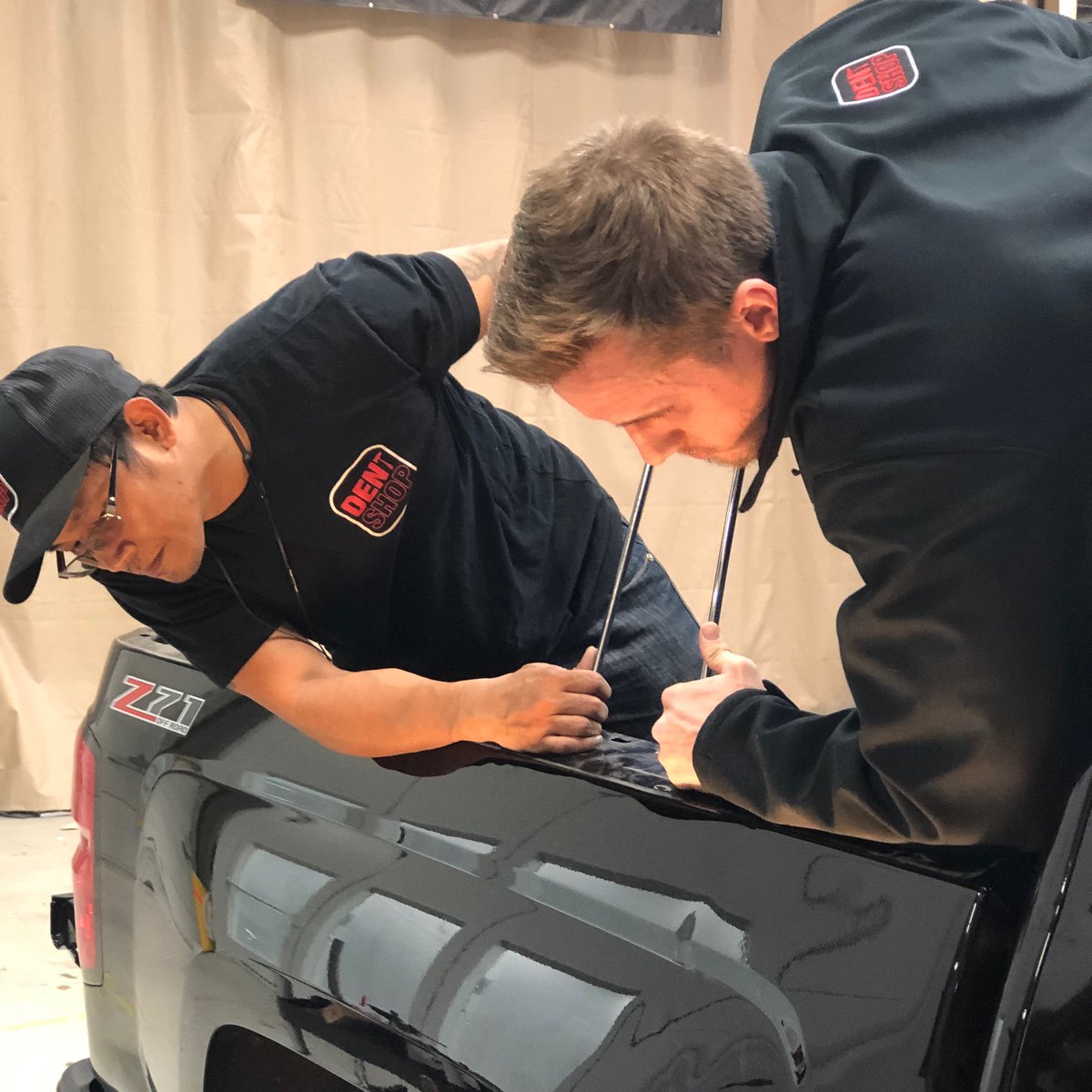 DentShopPDR's tweet photo. At Dent Shop we know that our team is crucial to our success.  Mark &amp; Tyler are rockstar dent technicians working together to fix a BIG DENT on this truck.  CALL NOW 571-293-2129 #team #together #teamwork #virginia #loudoun #dentrepair #paintlessdentrepair #truck #repair #usa https://t.co/IvEdRduT5O